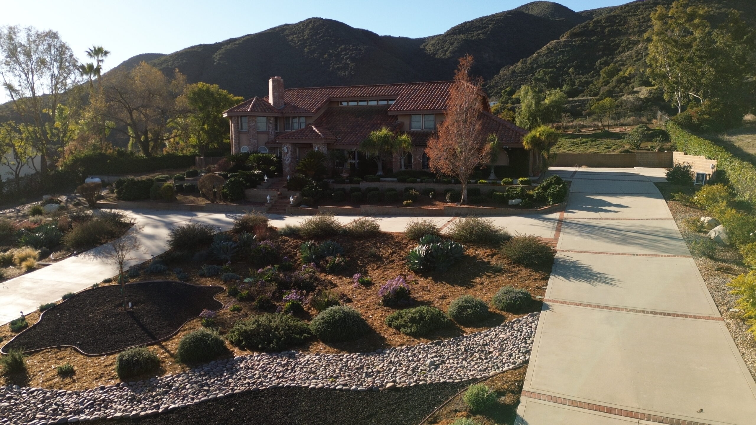 Drone aerial view of a residential property inspected during a home inspection in Corona, California