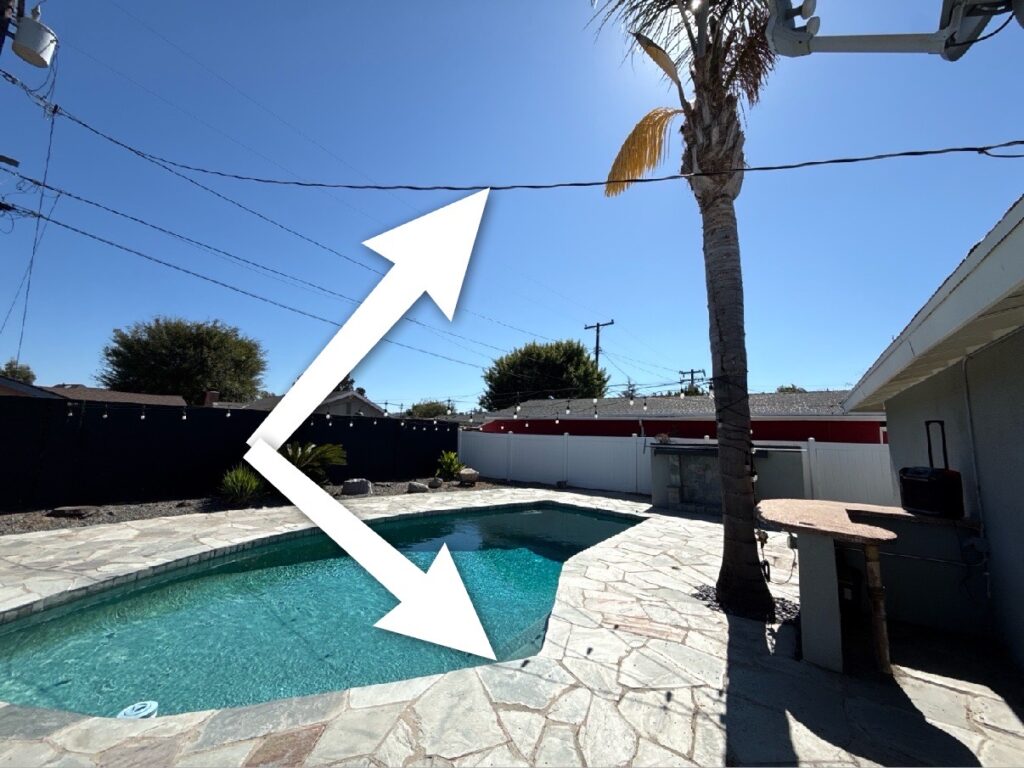 Electrical service lines crossing above a swimming pool during a home inspection